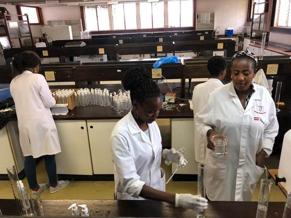 The University of Eswatini team working in the lab to produce hand sanitizer and help their community respond to COVID-19 in early March.