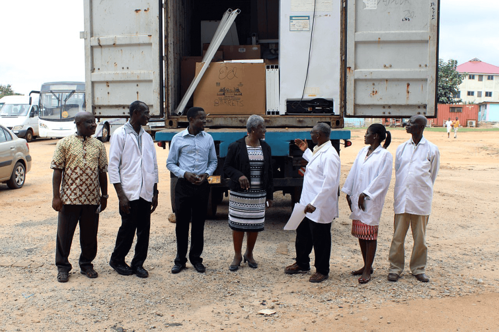 Faculty and staff greet the container of Instrumental Access equipment upon its arrival at Garden City University College in August 2016.