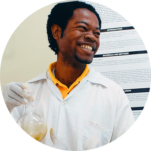 African male researcher holding a volumetric flask